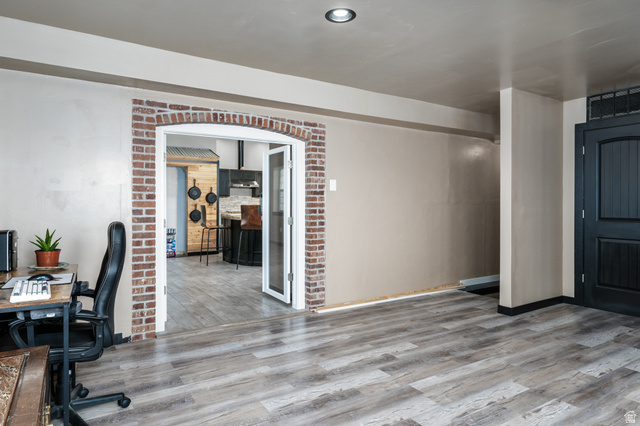 19994 South Olson Road Downey, ID 83234 - Photo 5 of 49 Office space featuring light wood-type flooring and arched walkways