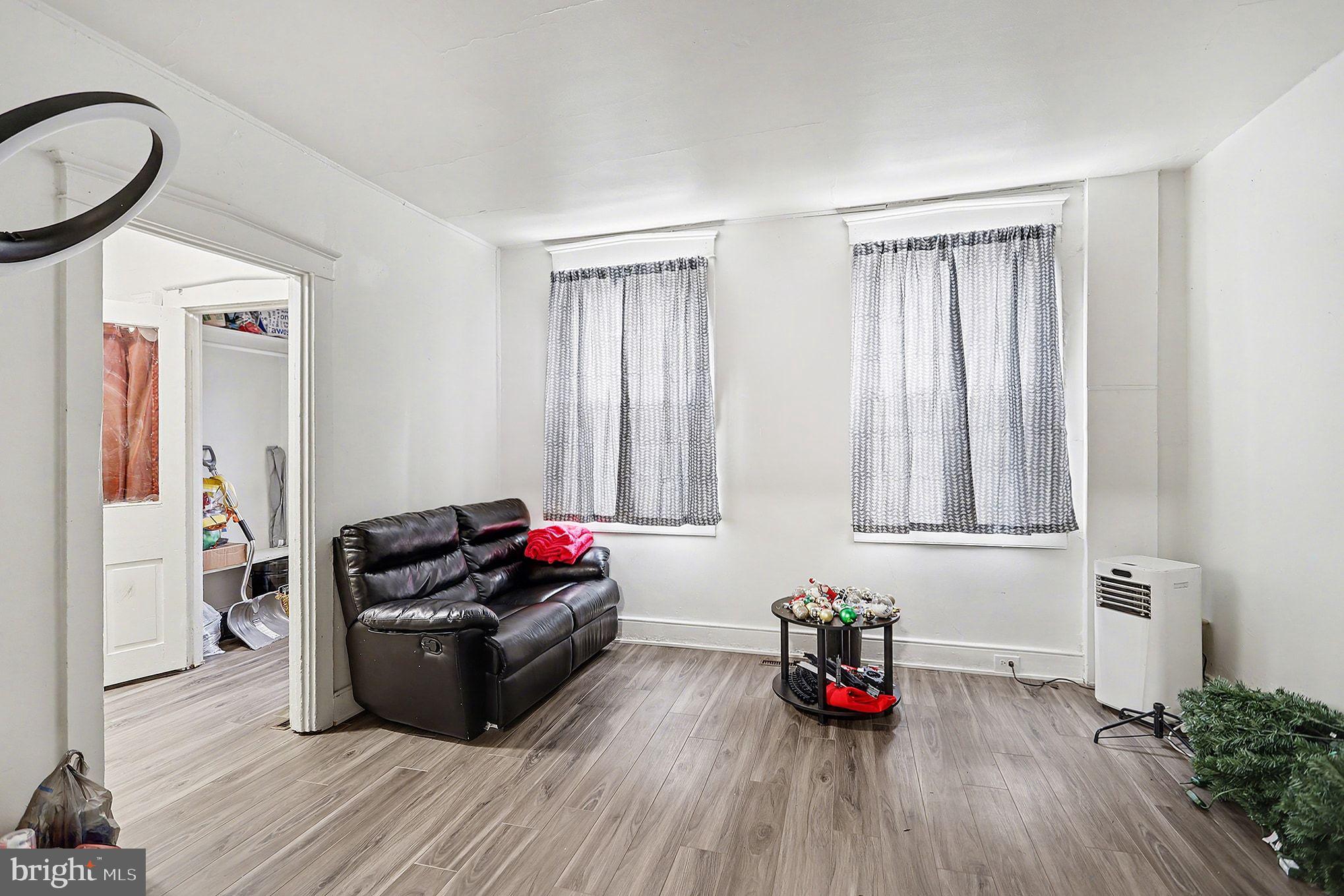 124 South Arch Street Lancaster, PA 17603 - Photo 7 of 34 a living room with furniture and wooden floor