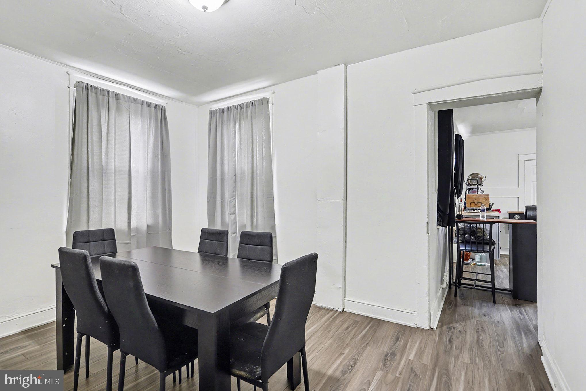 124 South Arch Street Lancaster, PA 17603 - Photo 8 of 34 a view of a dining room with furniture and wooden floor