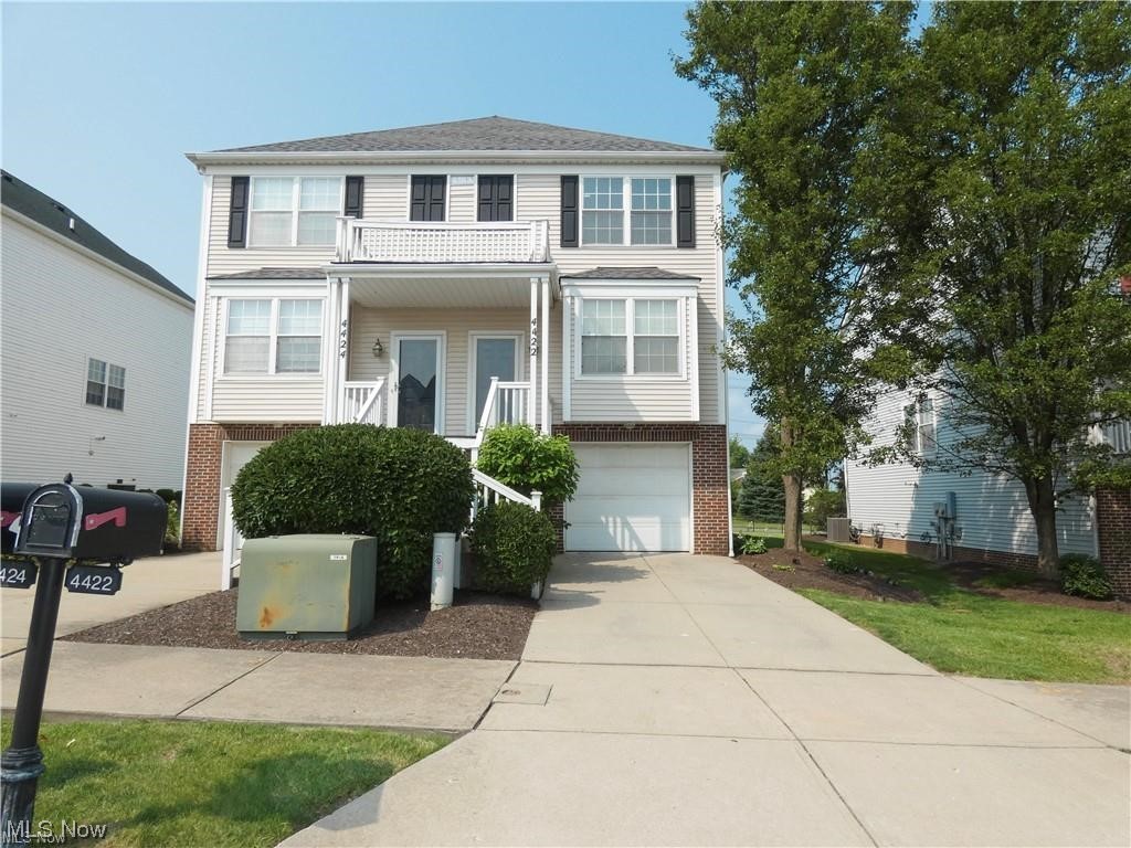 4422 Sexton Road Cleveland, OH 44105 - Photo 2 of 30 View of front of property featuring a garage and central AC unit