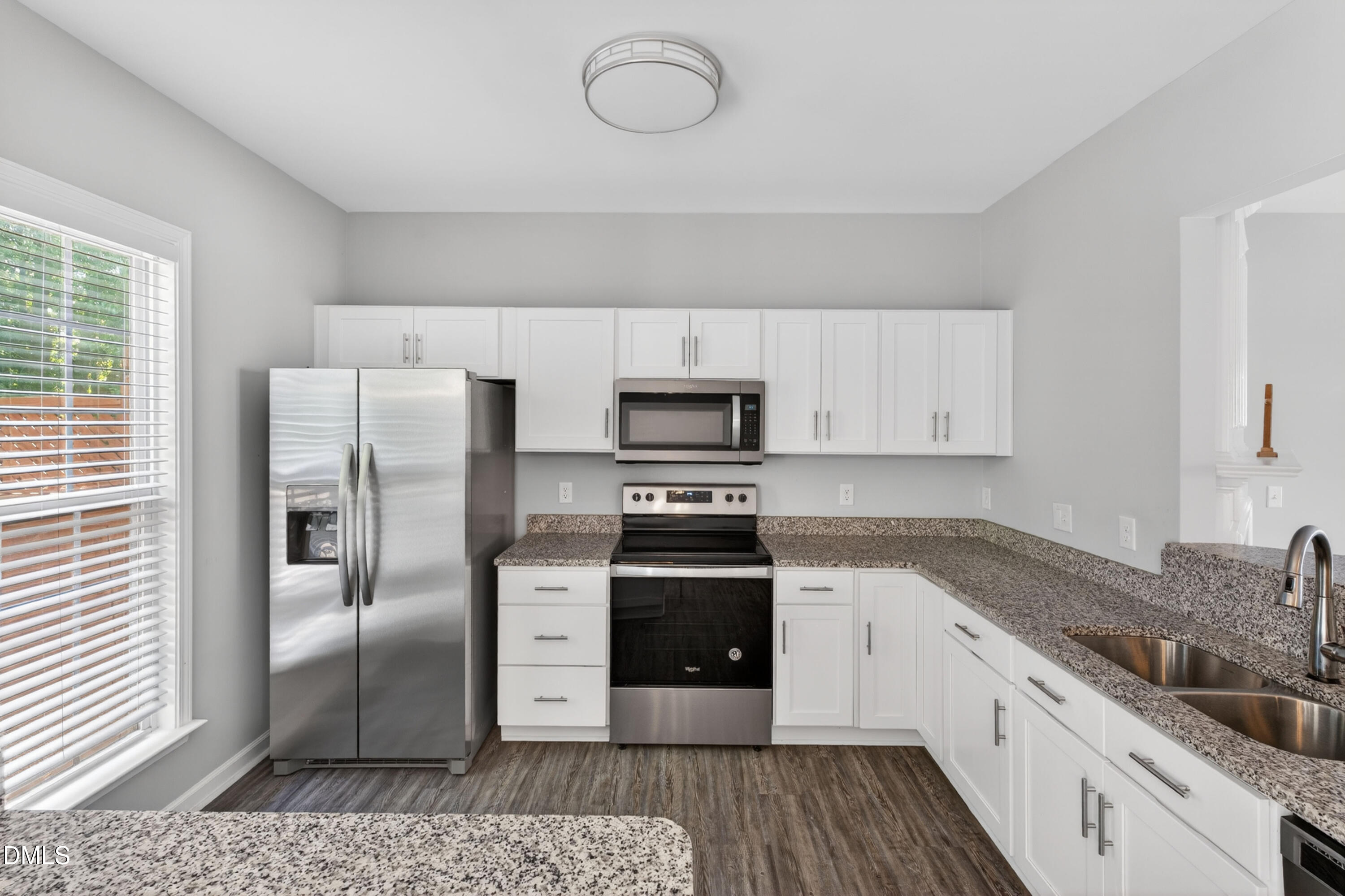 5421 Golden Arrow Lane Raleigh, NC 27613 - Photo 20 of 49 a kitchen with stainless steel appliances granite countertop a refrigerator and a stove
