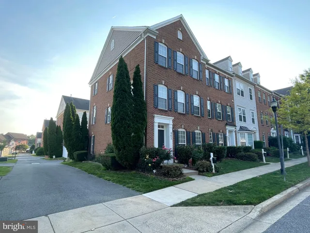 a front view of a building with garden