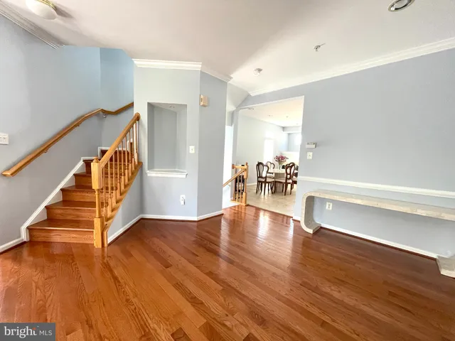 a view of an entryway with wooden floor
