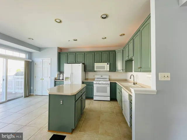 a kitchen with cabinets and sink