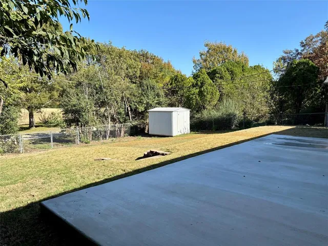 a view of a swimming pool with an outdoor space