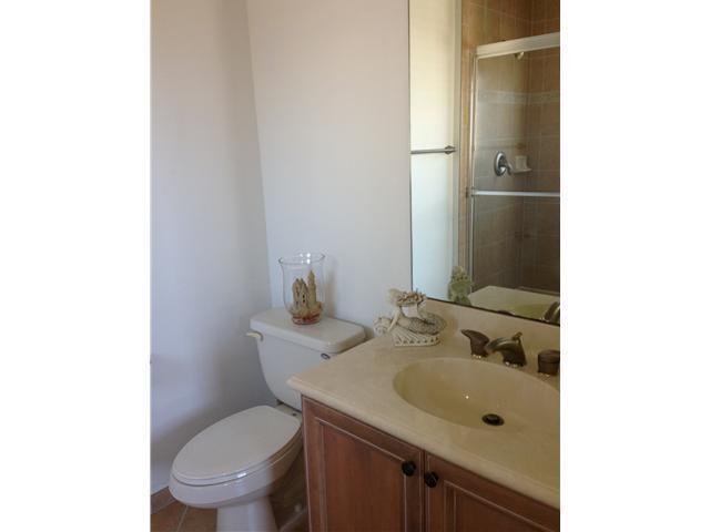 4127 Sandy Spit Lane Jupiter, FL 33458 - Photo 11 of 24 a bathroom with a sink toilet and mirror
