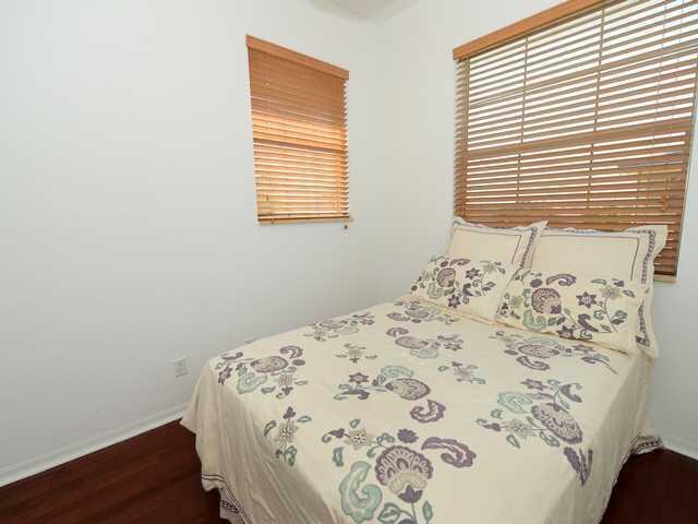 4127 Sandy Spit Lane Jupiter, FL 33458 - Photo 17 of 24 a bedroom with a bed and a window