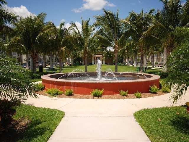 4127 Sandy Spit Lane Jupiter, FL 33458 - Photo 21 of 24 a view of a swimming pool with an outdoor space and seating area