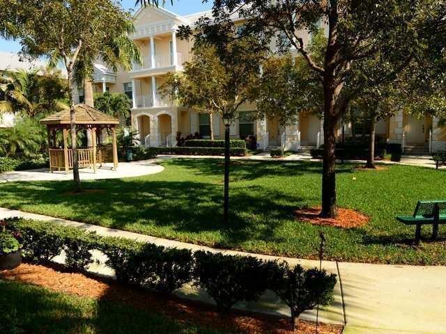 4127 Sandy Spit Lane Jupiter, FL 33458 - Photo 3 of 24 a front view of a house with a yard