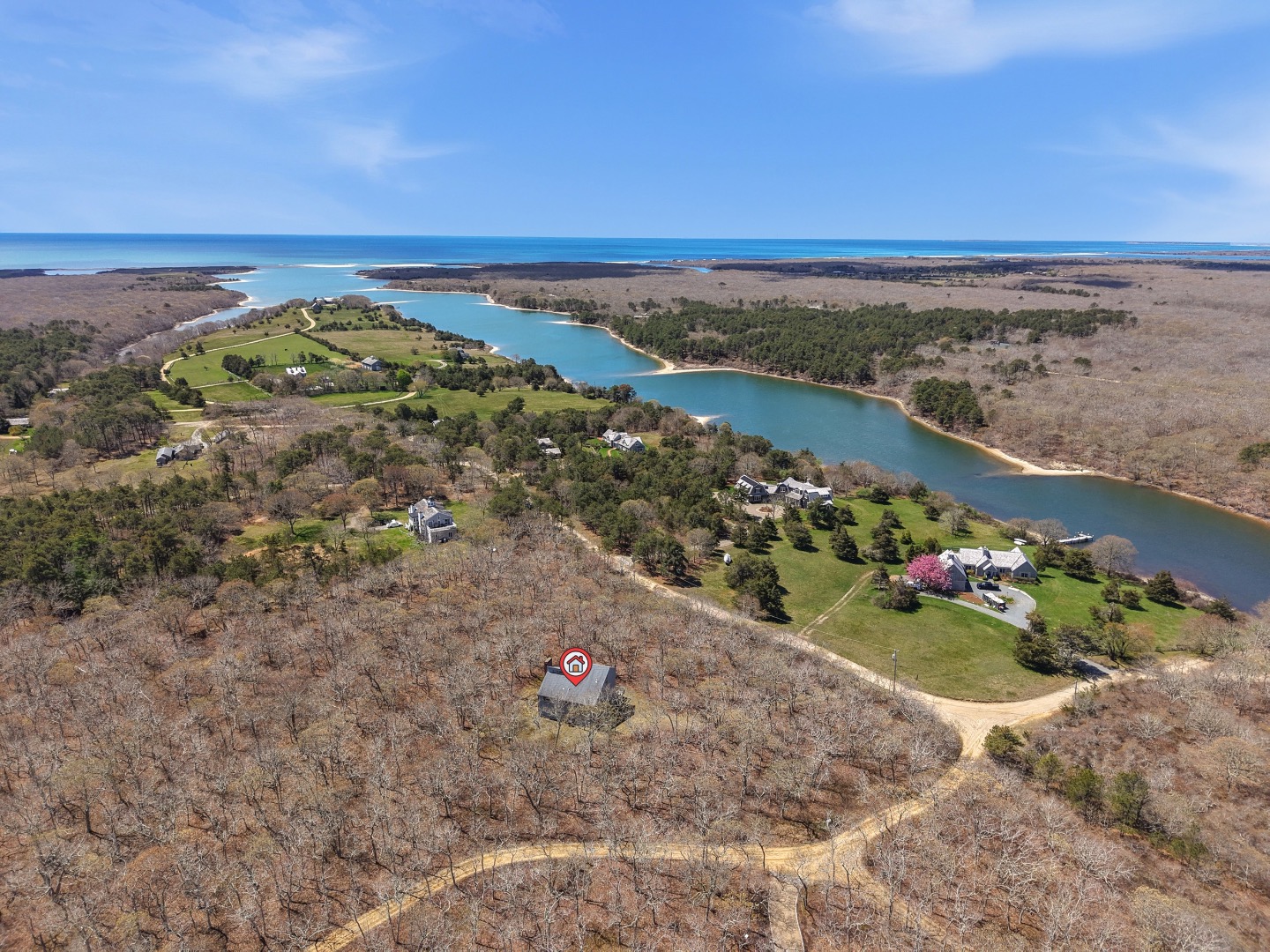 82 Oyster Pond Road Edgartown, MA 02539 - Photo 44 of 53 a view of a lake with a mountain in the background