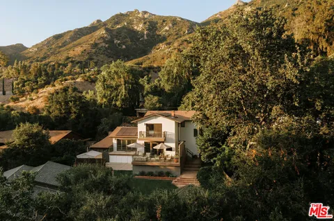 a house with trees in front of it