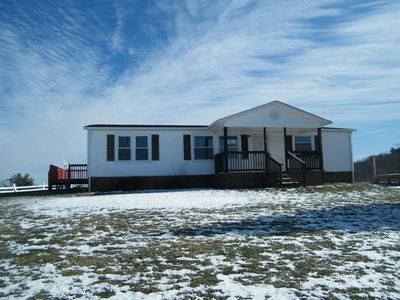 1043 Lick Ridge Road Northeast Check, VA 24072 - Photo 1 of 11 a front view of a house with a yard