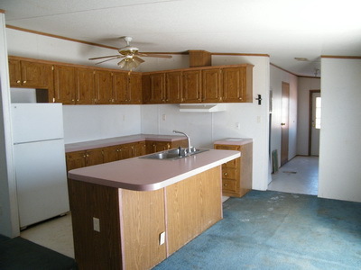 1043 Lick Ridge Road Northeast Check, VA 24072 - Photo 4 of 11 a kitchen with a sink and a refrigerator