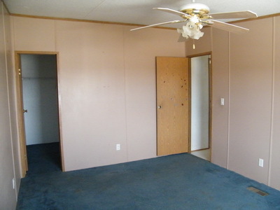 1043 Lick Ridge Road Northeast Check, VA 24072 - Photo 7 of 11 an empty room with a bathroom and a chandelier fan