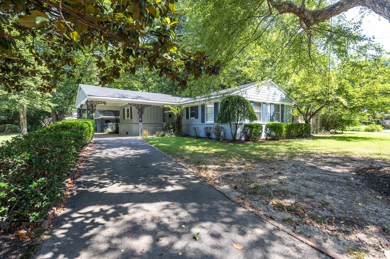 1004 South Perkins Road Memphis, TN 38117 - Photo 18 of 19 a front view of a house with yard and green space