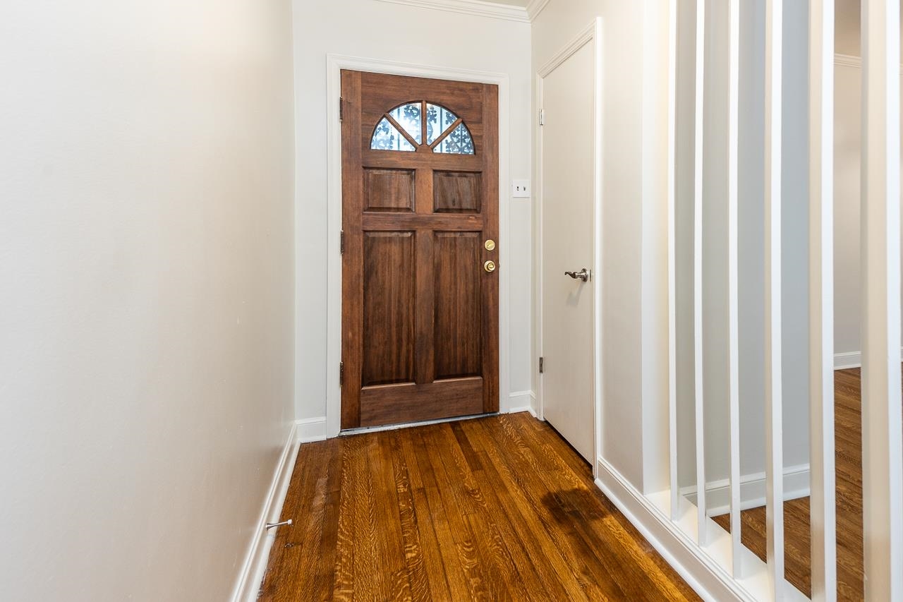 1004 South Perkins Road Memphis, TN 38117 - Photo 4 of 19 a view of front door with wooden floor