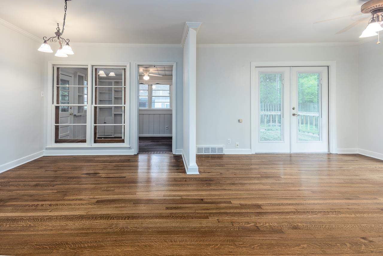 1004 South Perkins Road Memphis, TN 38117 - Photo 6 of 19 a view of empty room with wooden floor and fan
