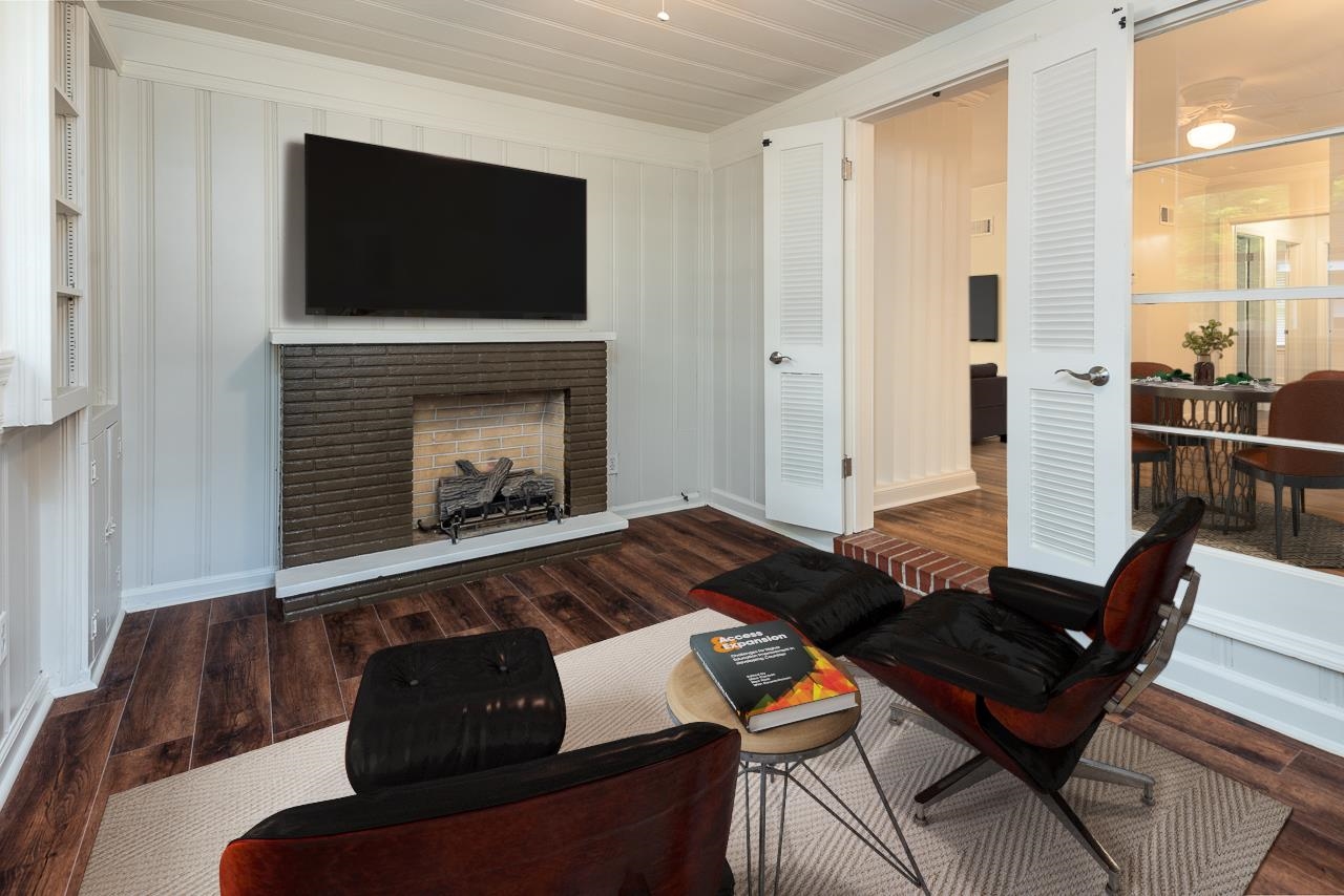 1004 South Perkins Road Memphis, TN 38117 - Photo 7 of 19 a living room with furniture fireplace and flat screen tv