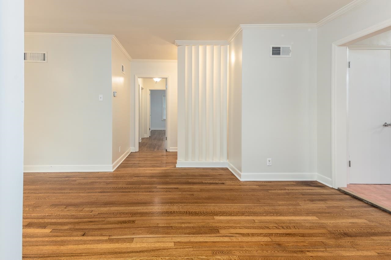 1004 South Perkins Road Memphis, TN 38117 - Photo 8 of 19 a view of a room with wooden floor
