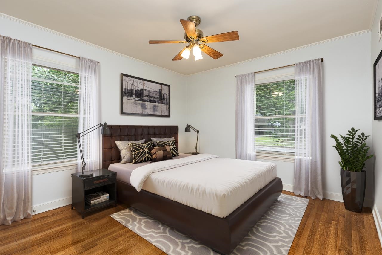 1004 South Perkins Road Memphis, TN 38117 - Photo 9 of 19 a bedroom with a bed and a large window