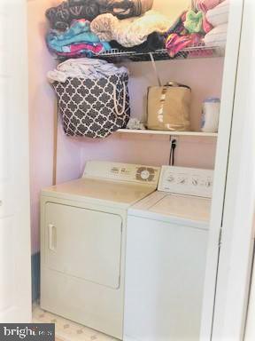210 Kuser Road Hamilton, NJ 08619 - Photo 6 of 41 Main floor laundry with lots of storage shelving.