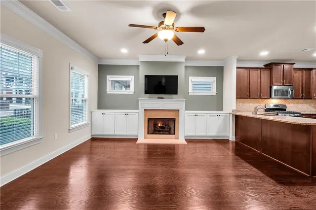 a bathroom with a granite countertop toilet a sink and a bathtub