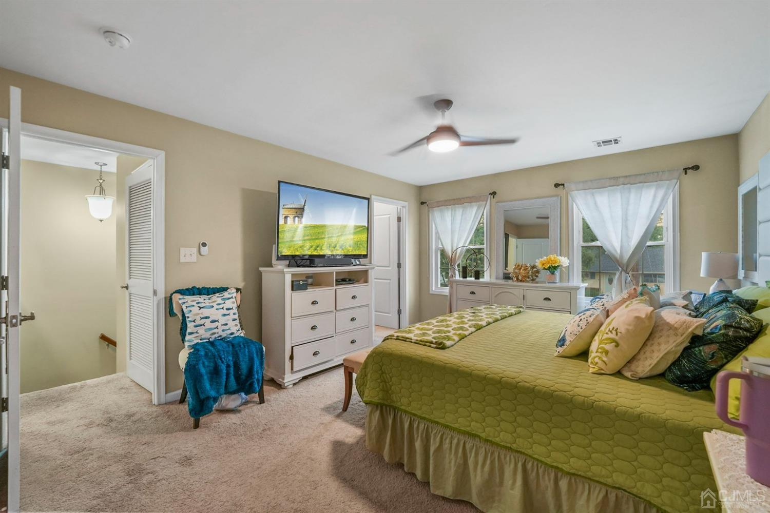 14 Baxter Road Edison, NJ 08817 - Photo 17 of 39 a bedroom with a balcony a bed and a television