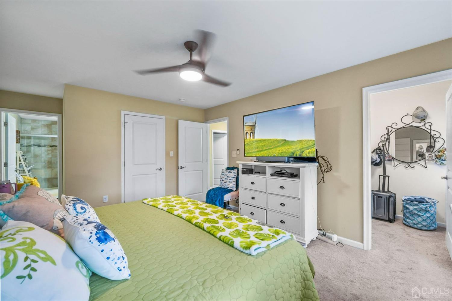 14 Baxter Road Edison, NJ 08817 - Photo 18 of 39 a bedroom with a bed and a flat screen tv