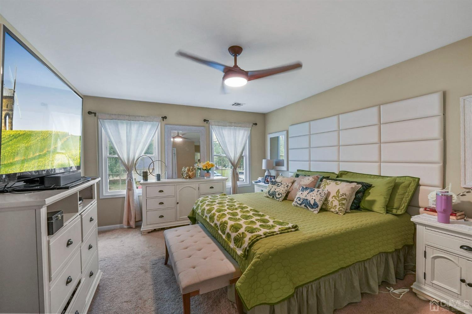 14 Baxter Road Edison, NJ 08817 - Photo 19 of 39 a bedroom with a bed and a flat screen tv