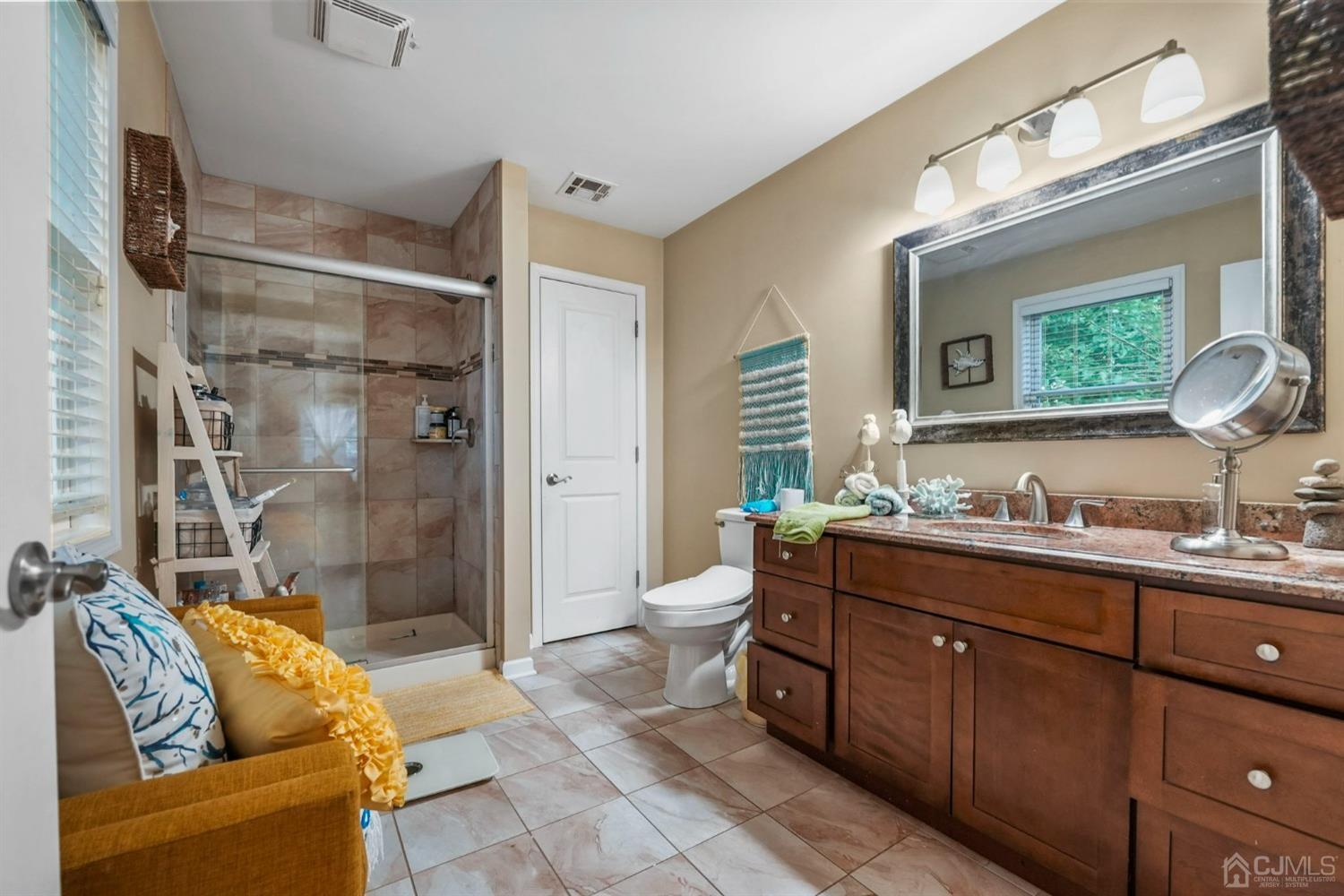 14 Baxter Road Edison, NJ 08817 - Photo 20 of 39 a spacious bathroom with a granite countertop sink toilet mirror and bathtub