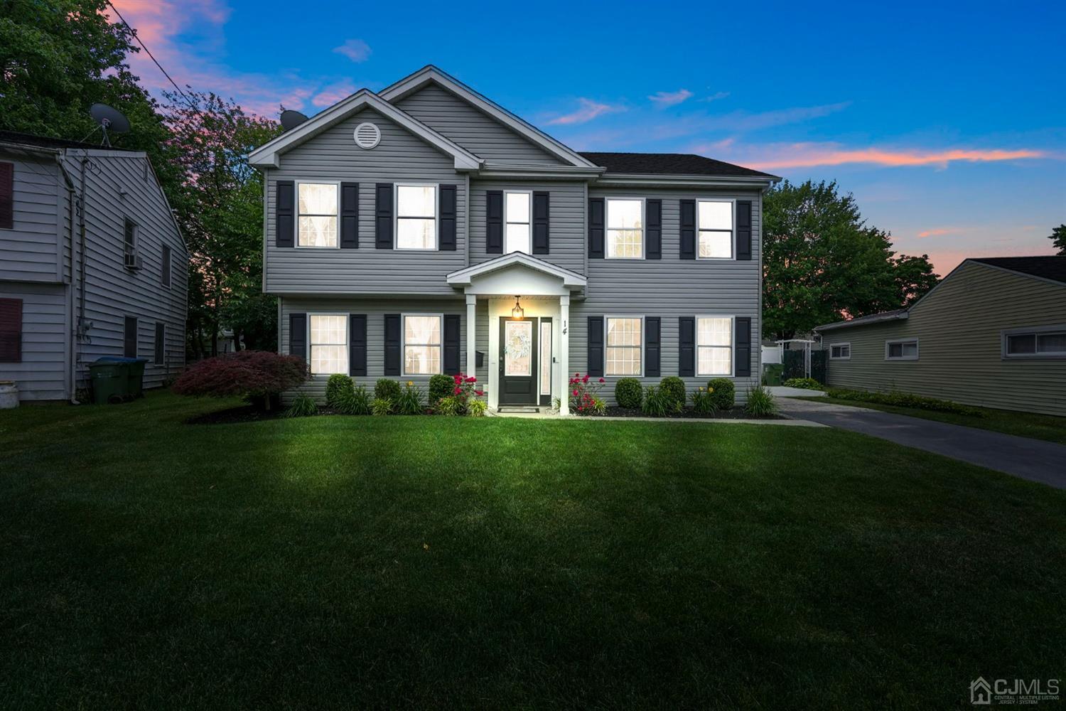 14 Baxter Road Edison, NJ 08817 - Photo 2 of 39 a front view of a house with a garden