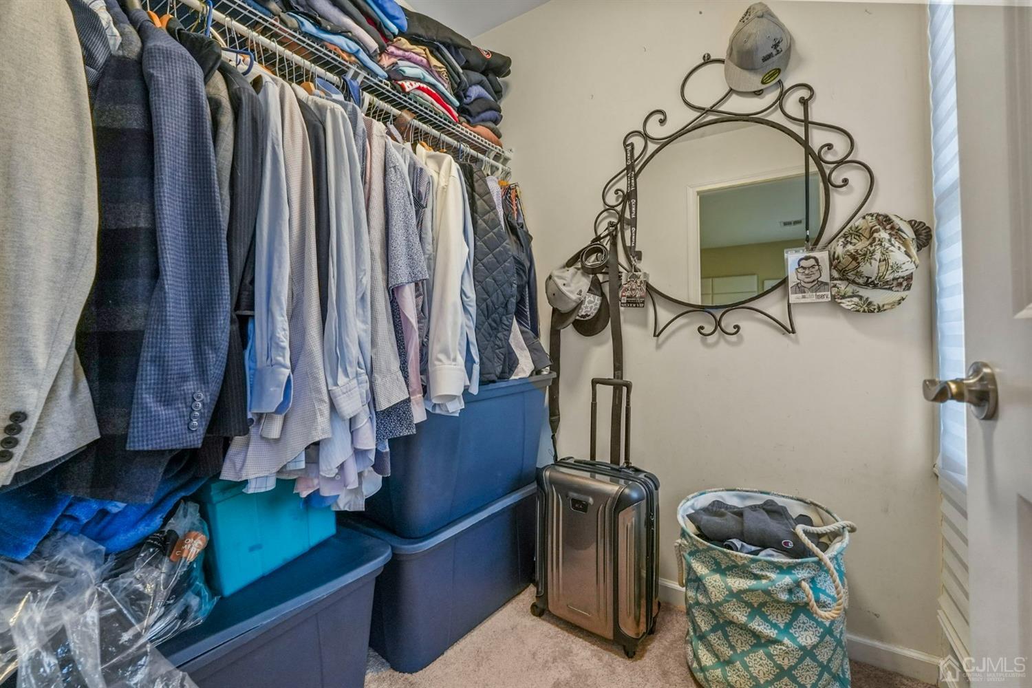14 Baxter Road Edison, NJ 08817 - Photo 21 of 39 a view of walk in closet with clothes and shoes