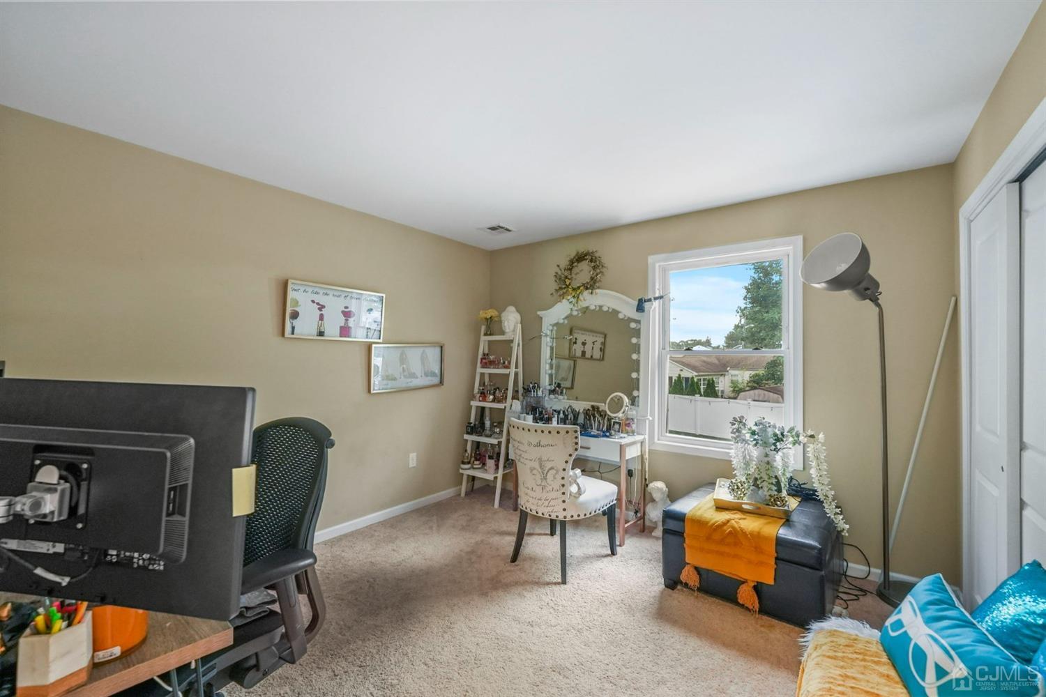 14 Baxter Road Edison, NJ 08817 - Photo 22 of 39 a living room with furniture and a window