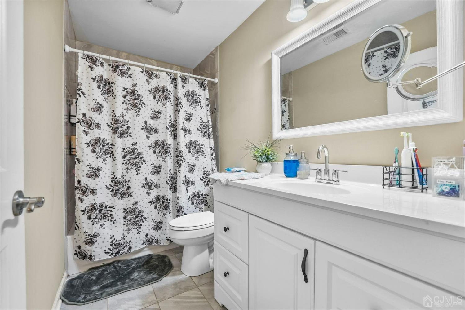 14 Baxter Road Edison, NJ 08817 - Photo 26 of 39 a bathroom with a sink toilet and shower