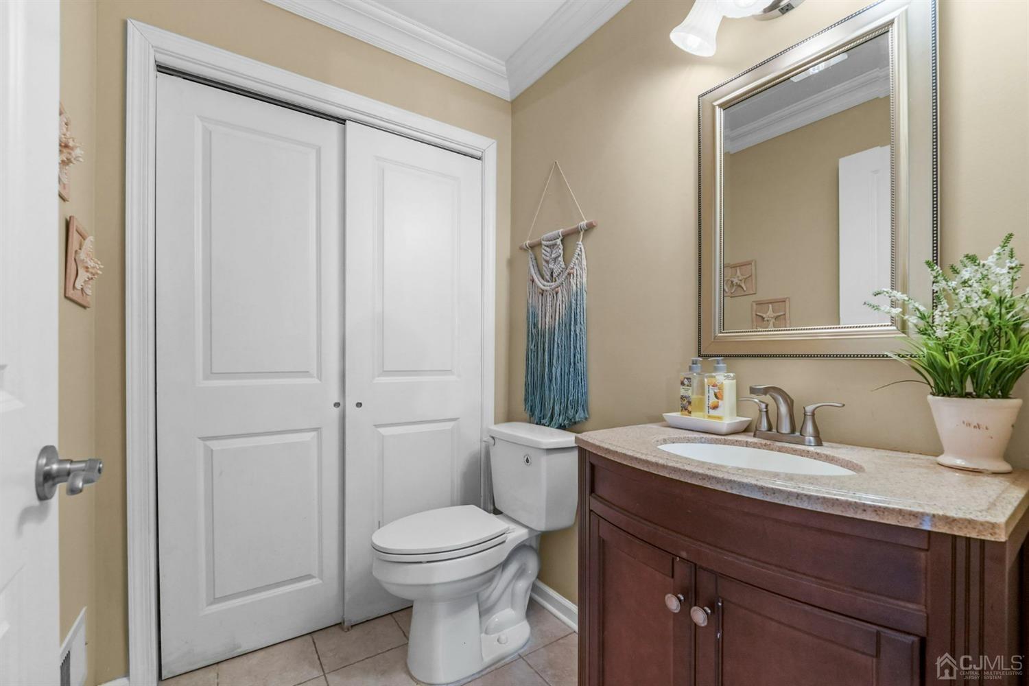 14 Baxter Road Edison, NJ 08817 - Photo 30 of 39 a bathroom with a sink a toilet and vanity