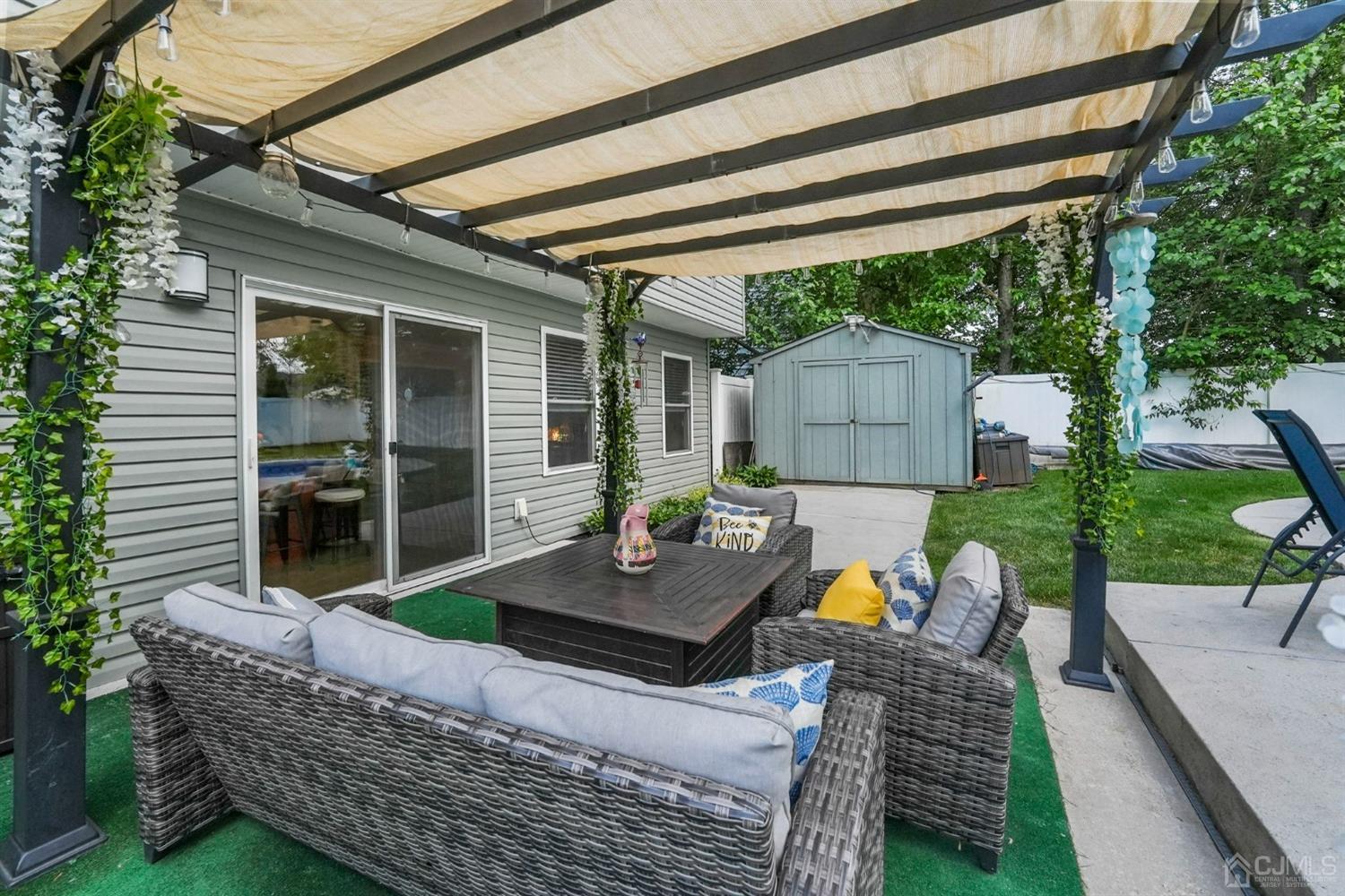 14 Baxter Road Edison, NJ 08817 - Photo 31 of 39 a view of a house with backyard and sitting area