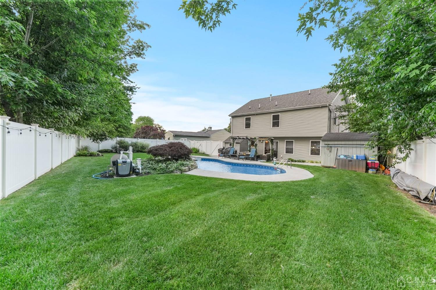 14 Baxter Road Edison, NJ 08817 - Photo 34 of 39 a view of a house with backyard sitting area and garden