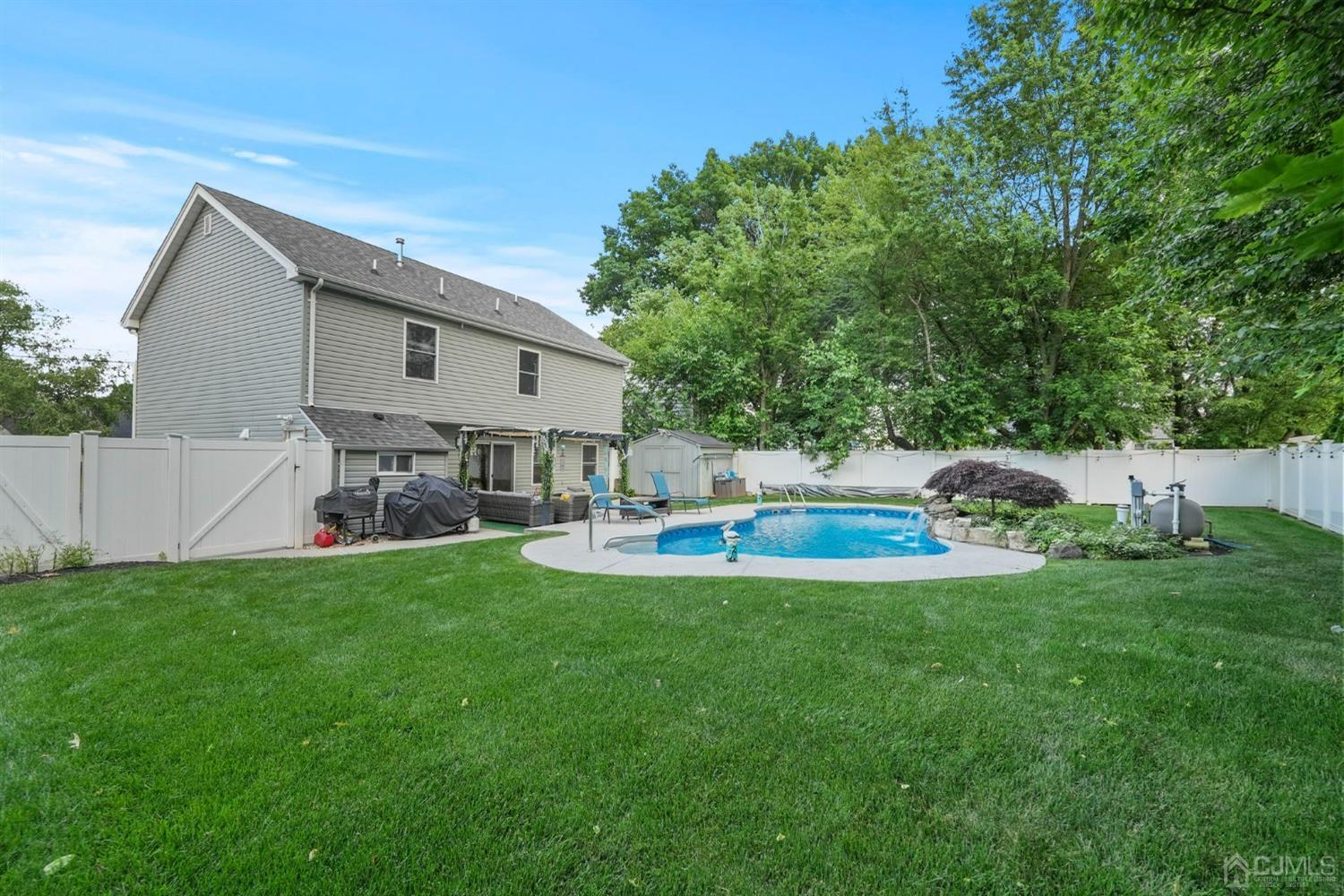 14 Baxter Road Edison, NJ 08817 - Photo 35 of 39 a view of a house with a yard porch and sitting area