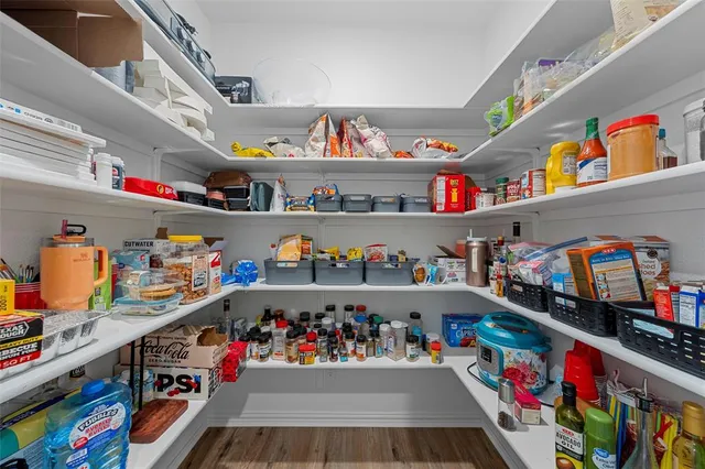 a view of a dining room with furniture wooden floor and chandelier
