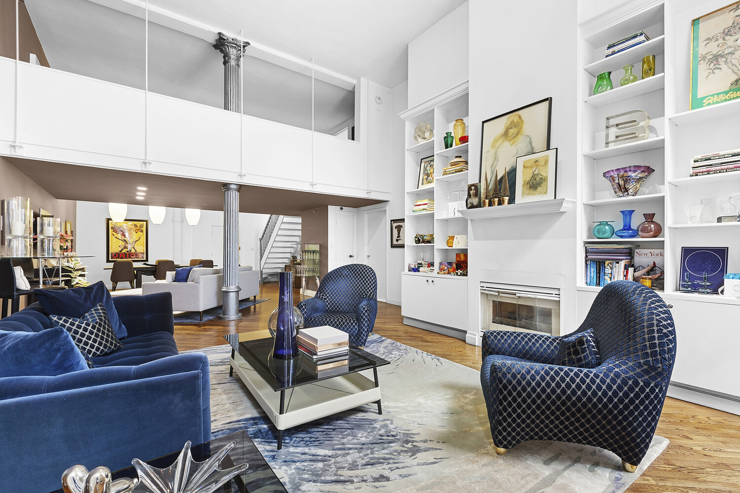 121 West 20th Street, Unit 2D Manhattan, NY 10011 - Photo 2 of 13 a living room with furniture fireplace and a large window