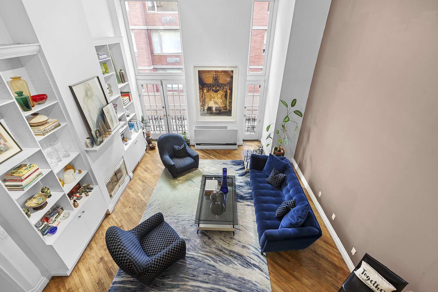 121 West 20th Street, Unit 2D Manhattan, NY 10011 - Photo 7 of 13 a living room with furniture and a fireplace
