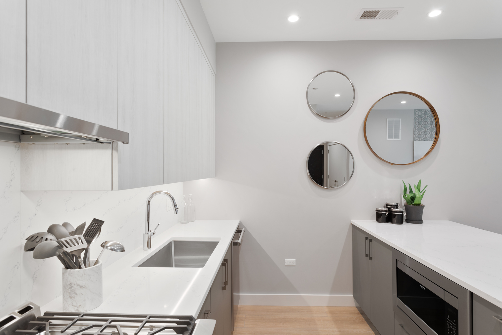 Undisclosed Address Chicago, IL 60618 - Photo 16 of 34 a bathroom with a sink and a mirror