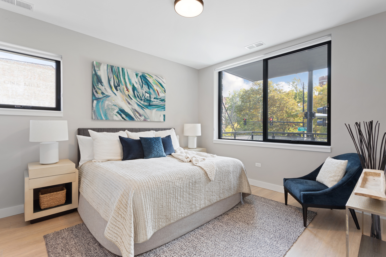 Undisclosed Address Chicago, IL 60618 - Photo 20 of 34 a bedroom with a bed and a large window