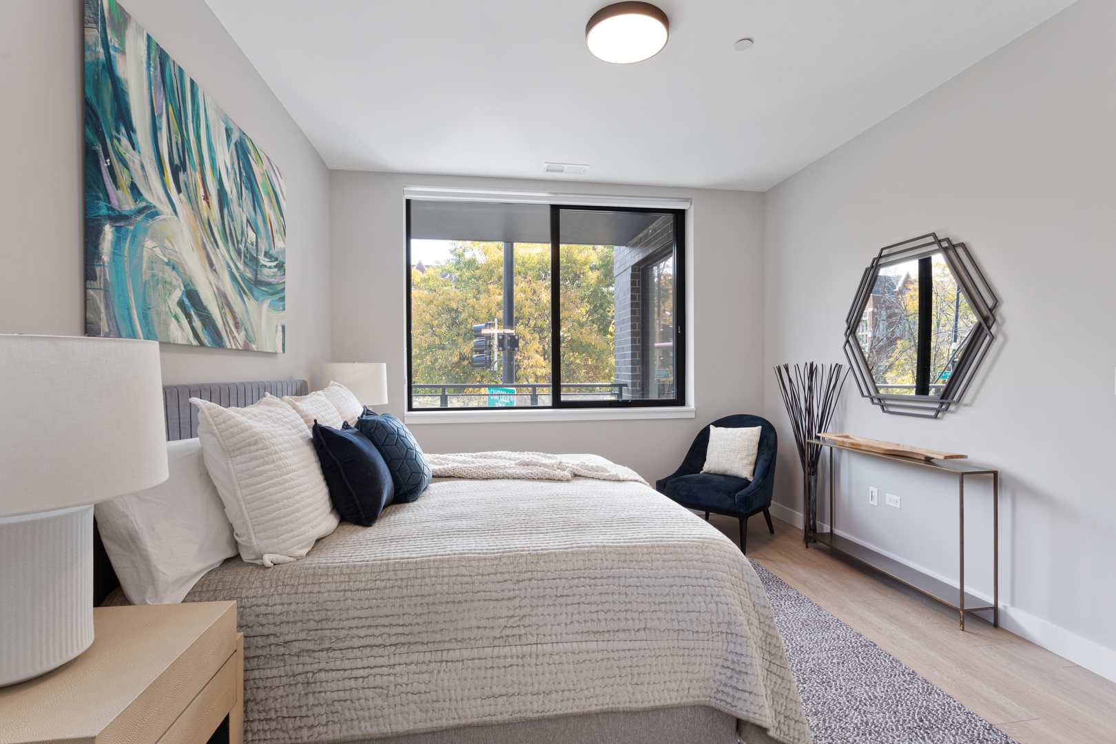 Undisclosed Address Chicago, IL 60618 - Photo 21 of 34 a bedroom with a large bed and a window