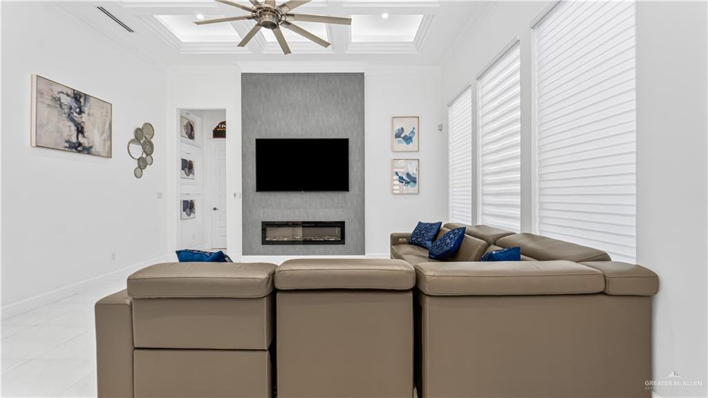1505 Duke Street Mission, TX 78572 - Photo 14 of 39 a living room with furniture and a fireplace