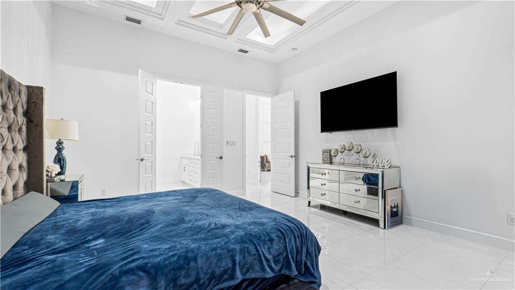 1505 Duke Street Mission, TX 78572 - Photo 16 of 39 a bedroom with a bed and a flat screen tv