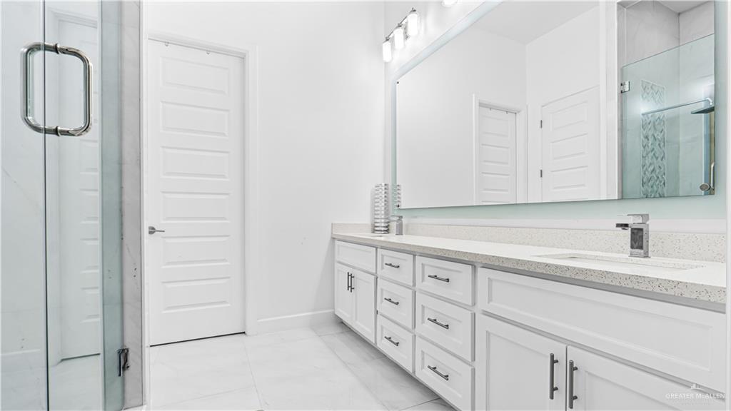 1505 Duke Street Mission, TX 78572 - Photo 18 of 39 a bathroom with a sink and a mirror