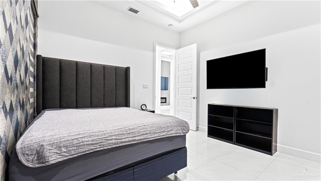 1505 Duke Street Mission, TX 78572 - Photo 22 of 39 a bedroom with a bed and a television