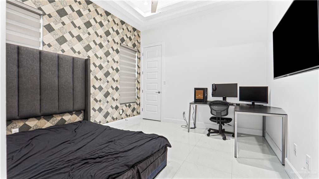 1505 Duke Street Mission, TX 78572 - Photo 25 of 39 a bedroom with a bed and a flat screen tv