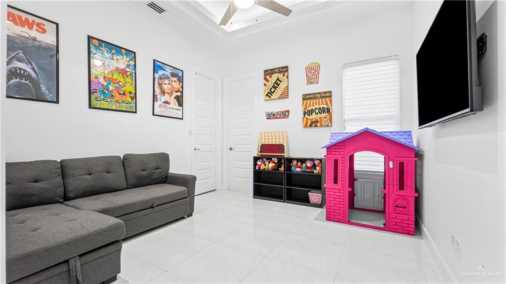 1505 Duke Street Mission, TX 78572 - Photo 28 of 39 a living room with furniture and a flat screen tv